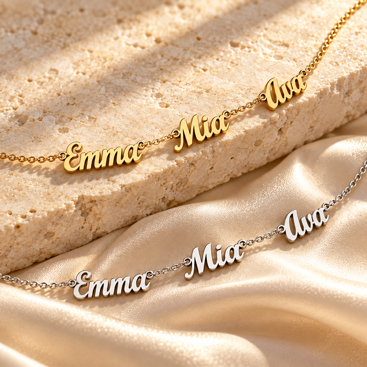 Close-up of gold and silver personalized name anklets on ivory stone and champagne silk